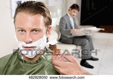 Man getting shaved in a salon View Large Photo Image Stock Image - Man getting shaved in a salon. Fotosearch