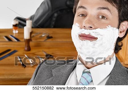 Man getting shaved in a salon View Large Photo Image Stock Image - Man getting shaved in a salon. Fotosearch