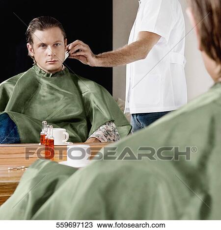 Man getting shaved in a salon View Large Photo Image Stock Image - Man getting shaved in a salon. Fotosearch