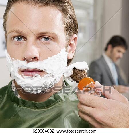 Man getting shaved in a salon View Large Photo Image Stock Image - Man getting shaved in a salon. Fotosearch