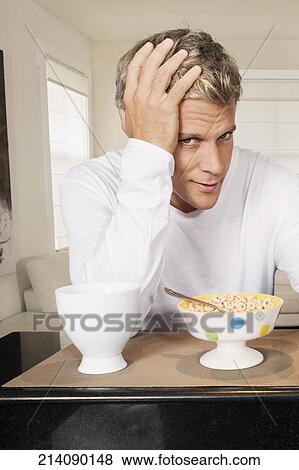 Man having breakfast View Large Photo Image Stock Photo - Man having breakfast. Fotosearch