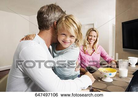 Man hugging his daughter View Large Photo Image Stock Photograph - Man hugging his daughter. Fotosearch