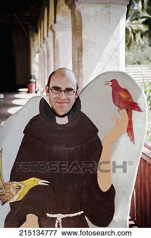 Stock Photo - Man in the corridor of a church, Mission Santa Barbara, Santa Barbara, California, USA. Fotosearch