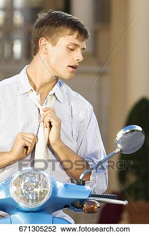 Man looking into a moped mirror, Biltmore Hotel, Coral Gables, Florida, USA View Large Photo Image Stock Image - Man looking into a moped mirror, Biltmore Hotel, Coral Gables, Florida, USA. Fotosearch