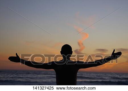 Man on the beach with his arms outstretched, Santa Monica, Los Angeles County, California, USA View Large Photo Image Stock Photography - Man on the beach with his arms outstretched, Santa Monica, Los Angeles County, California, USA. Fotosearch