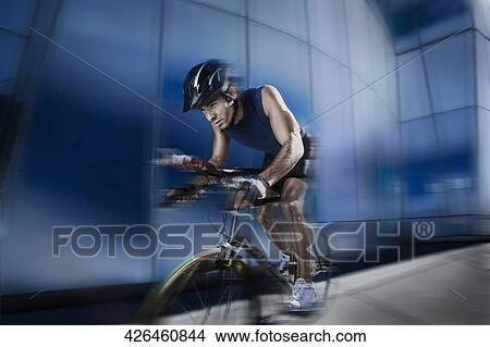 Man participating in a bicycle race View Large Photo Image Picture - Man participating in a bicycle race. Fotosearch