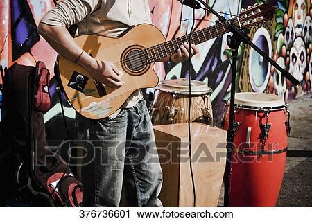 Man playing a guitar, Haight-Ashbury, San Francisco, California, USA View Large Photo Image Stock Image - Man playing a guitar, Haight-Ashbury, San Francisco, California, USA. Fotosearch