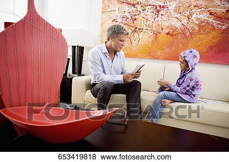 Man playing cards with his daughter View Large Photo Image Stock Photo - Man playing cards with his daughter. Fotosearch