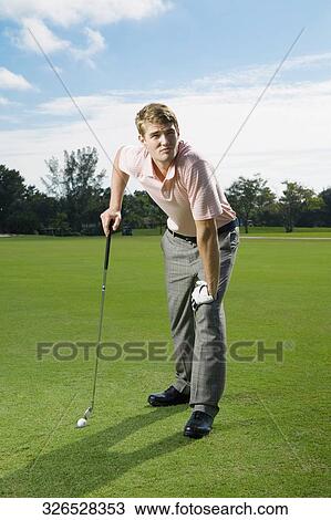 Man playing golf in a golf course, Biltmore Golf Course, Coral Gables, Florida, USA View Large Photo Image Stock Image - Man playing golf in a golf course, Biltmore Golf Course, Coral Gables, Florida, USA. Fotosearch