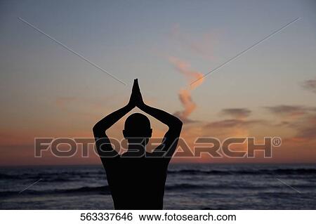 Man practicing yoga on the beach, Santa Monica, Los Angeles County, California, USA View Large Photo Image Stock Photograph - Man practicing yoga on the beach, Santa Monica, Los Angeles County, California, USA. Fotosearch