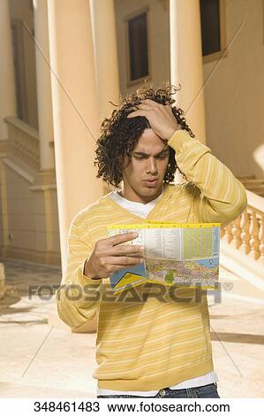 Man reading a map, Biltmore Hotel, Coral Gables, Florida, USA View Large Photo Image Stock Image - Man reading a map, Biltmore Hotel, Coral Gables, Florida, USA. Fotosearch