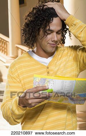 Man reading a map, Biltmore Hotel, Coral Gables, Florida, USA View Large Photo Image Stock Photo - Man reading a map, Biltmore Hotel, Coral Gables, Florida, USA. Fotosearch