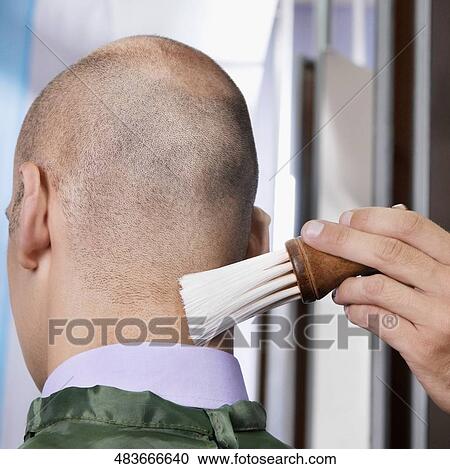 Man receiving a haircut in a salon View Large Photo Image Stock Image - Man receiving a haircut in a salon. Fotosearch