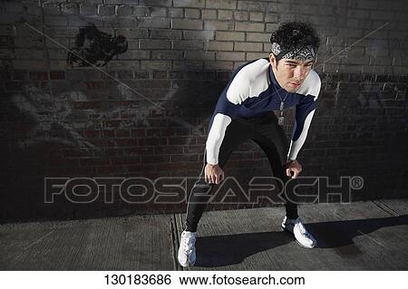 Man resting after exercise View Large Photo Image Stock Photograph - Man resting after exercise. Fotosearch