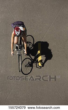 Stock Photo - Man riding a bicycle on the road, Hudson River, New York City, New York State, USA. Fotosearch