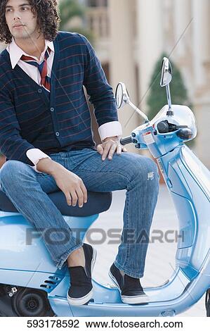 Man sitting on a moped and thinking, Biltmore Hotel, Coral Gables, Florida, USA View Large Photo Image Stock Image - Man sitting on a moped and thinking, Biltmore Hotel, Coral Gables, Florida, USA. Fotosearch