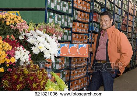 Man standing in a warehouse, Miami, Florida, USA View Large Photo Image Stock Photograph - Man standing in a warehouse, Miami, Florida, USA. Fotosearch