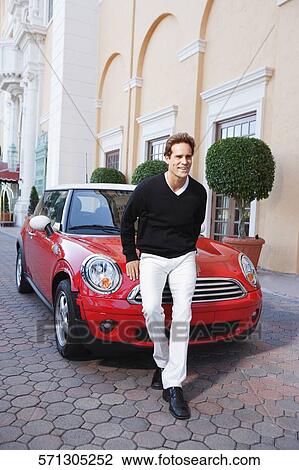 Man standing in front of a car and smiling, Biltmore Hotel, Coral Gables, Florida, USA View Large Photo Image Stock Image - Man standing in front of a car and smiling, Biltmore Hotel, Coral Gables, Florida, USA. Fotosearch