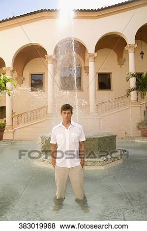 Man standing in water at a fountain, Biltmore Hotel, Coral Gables, Florida, USA View Large Photo Image Stock Photo - Man standing in water at a fountain, Biltmore Hotel, Coral Gables, Florida, USA. Fotosearch