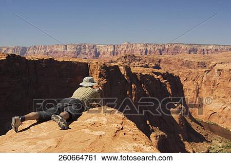 Man taking a picture of cliffs, Horseshoe Bend, Page, Arizona, USA View Large Photo Image Stock Image - Man taking a picture of cliffs, Horseshoe Bend, Page, Arizona, USA. Fotosearch