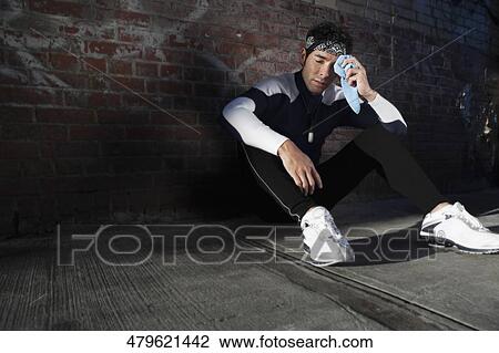 Man wiping his sweat after exercise View Large Photo Image Stock Image - Man wiping his sweat after exercise. Fotosearch