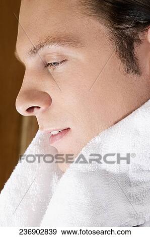 Stock Photo - Man with a towel around his shoulders. Fotosearch