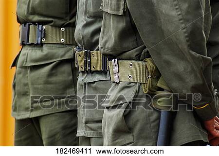 Mid section view of three policemen standing in a row View Large Photo Image Stock Image - Mid section view of three policemen standing in a row. Fotosearch