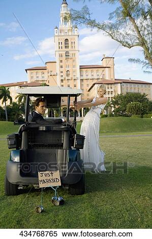 Newlywed couple in a golf course, Biltmore Golf Course, Biltmore Hotel, Coral Gables, Florida, USA View Large Photo Image Stock Photography - Newlywed couple in a golf course, Biltmore Golf Course, Biltmore Hotel, Coral Gables, Florida, USA. Fotosearch