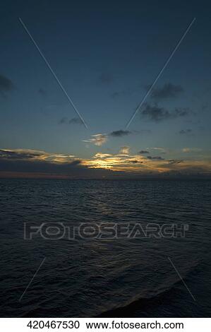 Panoramic view of the sea at sunset View Large Photo Image Stock Image - Panoramic view of the sea at sunset. Fotosearch