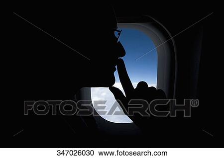 Stock Image - Passenger in an airplane. Fotosearch