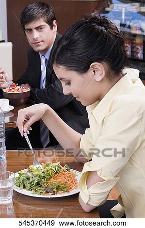 People dining in a restaurant View Large Photo Image Stock Photo - People dining in a restaurant. Fotosearch
