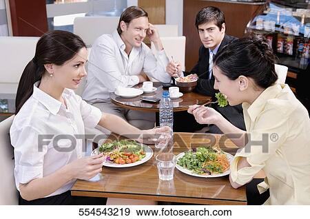Stock Photo - People dining in a restaurant. Fotosearch