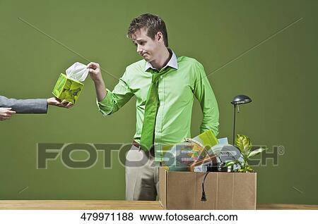 Stock Photo - Person's hand offering tissue paper to a fired businessman. Fotosearch