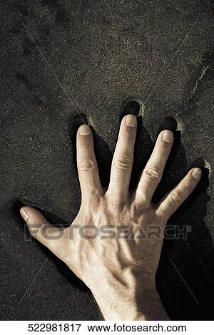 Person's hand on a handprint View Large Photo Image Stock Photo - Person's hand on a handprint. Fotosearch