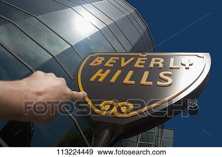Person's hand pointing towards Beverly Hills signboard, Beverly Hills, Los Angeles County, California, USA View Large Photo Image Stock Photo - Person's hand pointing towards Beverly Hills signboard, Beverly Hills, Los Angeles County, California, USA. Fotosearch