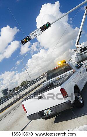 Pick-up truck and a mobile crane on a drawbridge View Large Photo Image Stock Photo - Pick-up truck and a mobile crane on a drawbridge. Fotosearch
