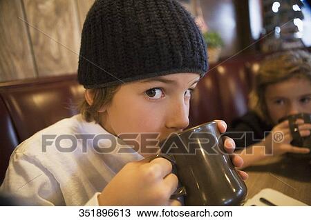 Portrait of a boy drinking tea View Large Photo Image Stock Image - Portrait of a boy drinking tea. Fotosearch