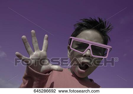 Stock Image - Portrait of a boy having fun. Fotosearch