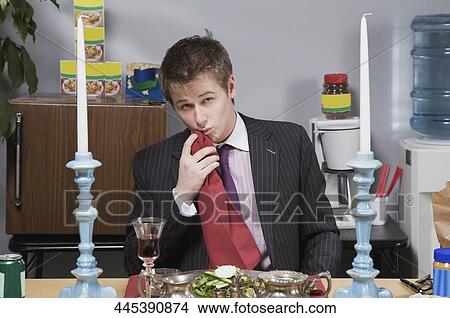 Portrait of a businessman cleaning his mouth with napkin after lunch View Large Photo Image Picture - Portrait of a businessman cleaning his mouth with napkin after lunch. Fotosearch