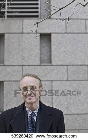 Stock Image - Portrait of a businessman smiling. Fotosearch