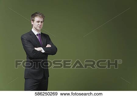 Portrait of a businessman smirking View Large Photo Image Stock Photo - Portrait of a businessman smirking. Fotosearch