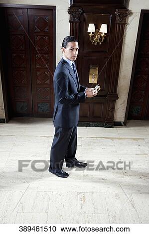 Portrait of a businessman standing in a hotel lobby, Biltmore Hotel, Coral Gables, Florida, USA View Large Photo Image Stock Image - Portrait of a businessman standing in a hotel lobby, Biltmore Hotel, Coral Gables, Florida, USA. Fotosearch