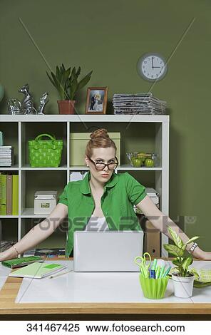 Stock Photography - Portrait of a businesswoman in the office. Fotosearch