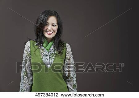 Stock Image - Portrait of a businesswoman smiling. Fotosearch