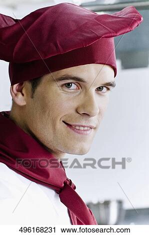 Portrait of a chef smiling View Large Photo Image Stock Image - Portrait of a chef smiling. Fotosearch