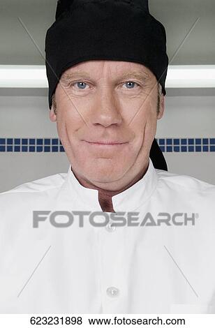 Portrait of a chef smiling View Large Photo Image Stock Photo - Portrait of a chef smiling. Fotosearch