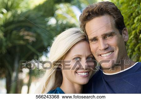Portrait of a couple smiling View Large Photo Image Stock Photo - Portrait of a couple smiling. Fotosearch