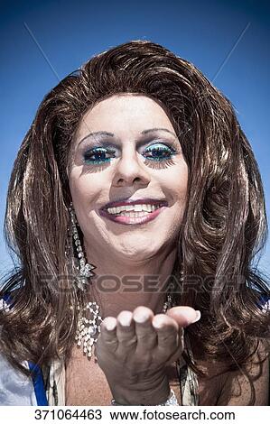 Stock Image - Portrait of a gay man smiling, DuPont Circle, Washington DC, USA. Fotosearch