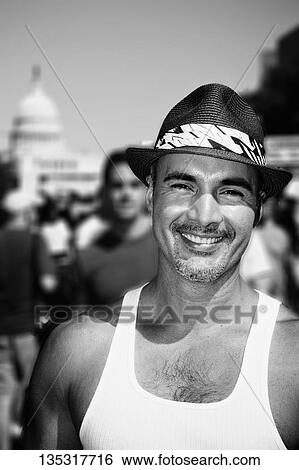Portrait of a gay man smiling with a government building in the background, State Capitol Building, Washington DC, USA View Large Photo Image Stock Photograph - Portrait of a gay man smiling with a government building in the background, State Capitol Building, Washington DC, USA. Fotosearch