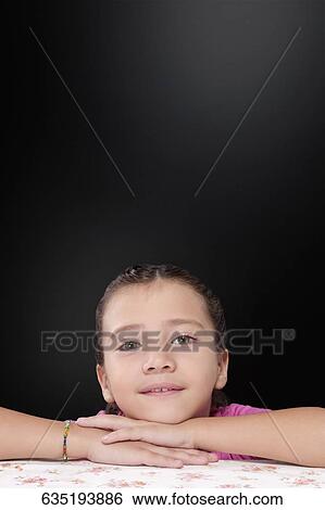 Portrait of a girl smiling View Large Photo Image Stock Photograph - Portrait of a girl smiling. Fotosearch